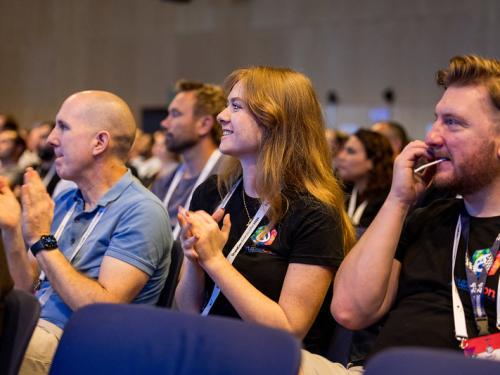Audience members cheer on the Drupal initiative track leads during DrupalCon Barcelona on Sept.