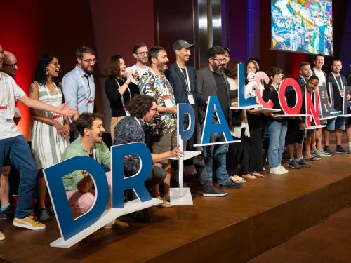 DrupalCon letter being held by Drupal Austria community,  Photo by Paul Johson