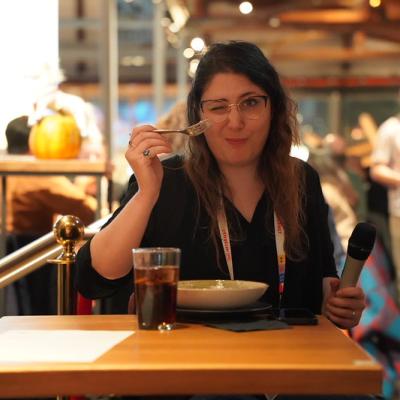 Taking a bite with mic in hand by Joris Vercammen